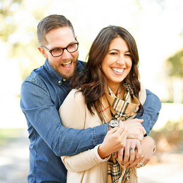 A smiling couple enjoying time outdoors